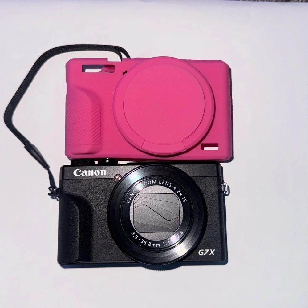 Canon G7X iii with pink cover and a black case